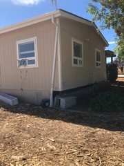 Fixer uper beige modular home for sale